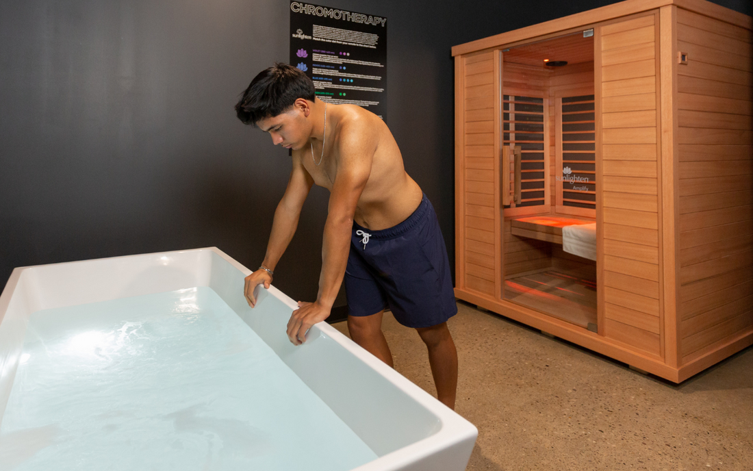 A person enjoying a cold plunge therapy session at Contrast Studios
