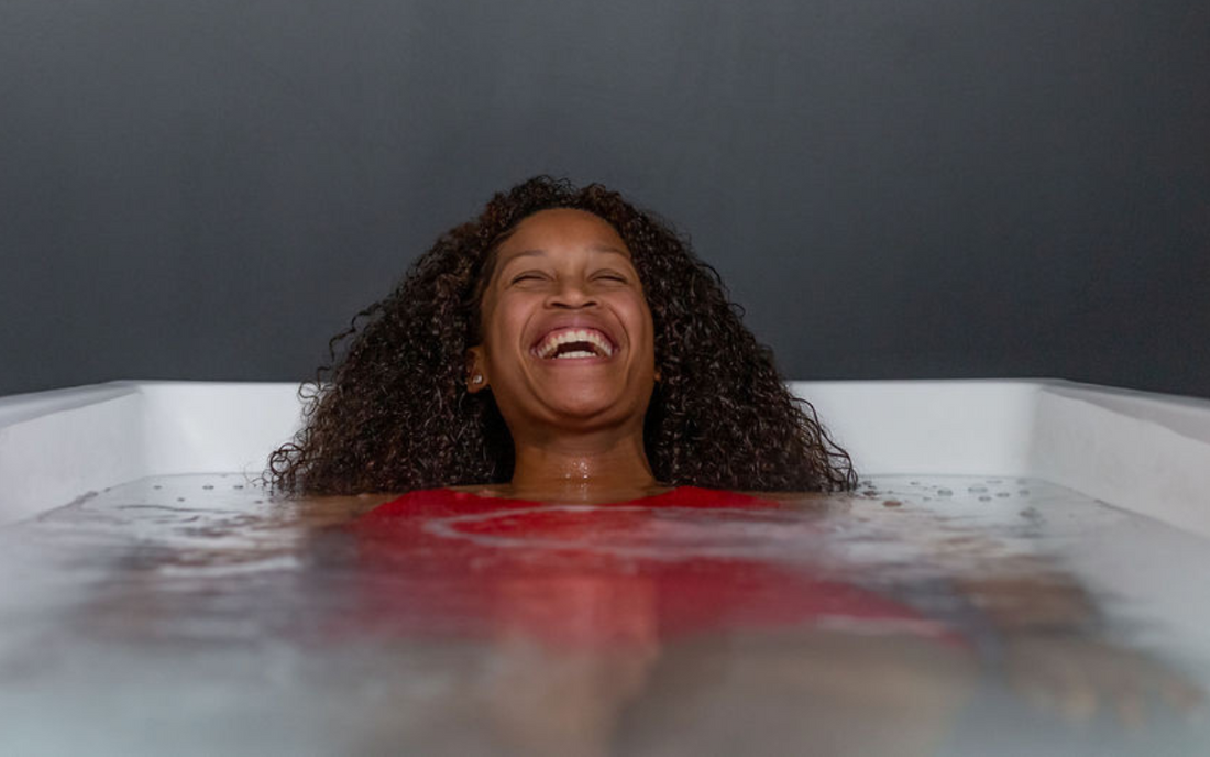 A person enjoying cold plunge therapy at Contrast Studios