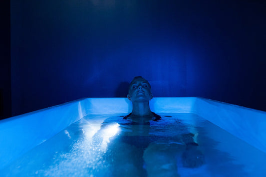 A person engaging in contrast therapy with an infrared sauna and cold plunge session